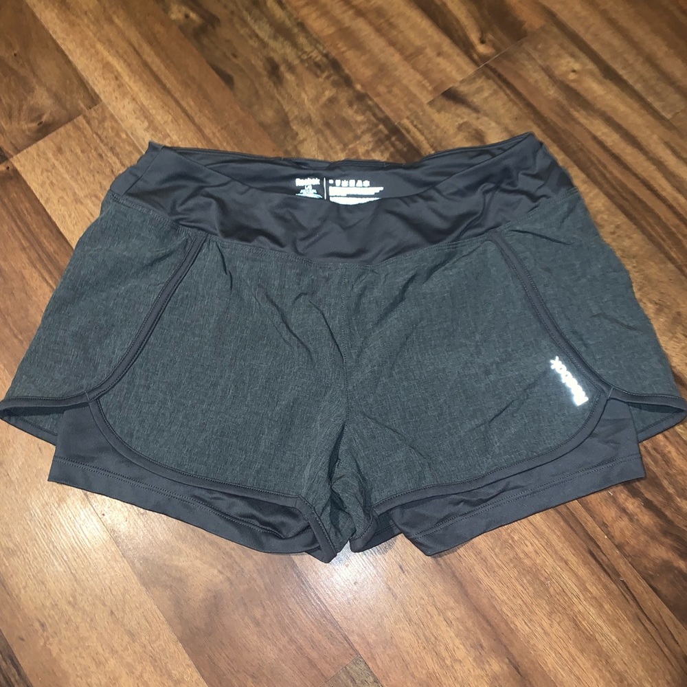 Size large Reebok layered athletic shorts.